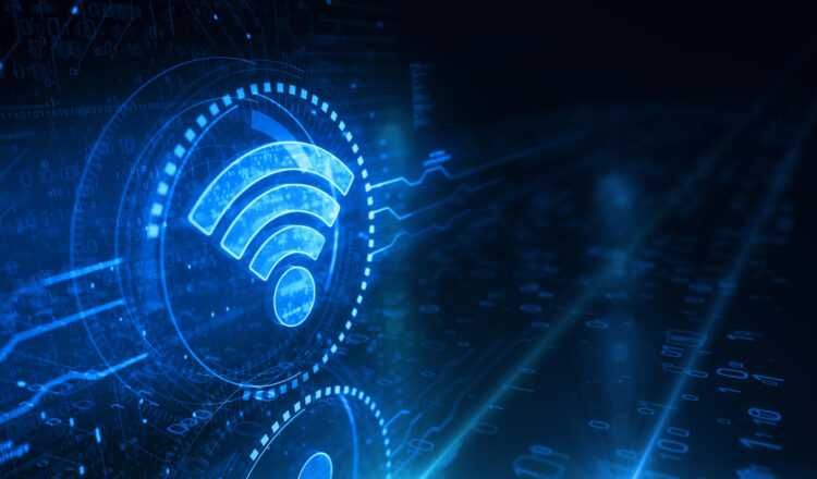 Routeur Wi-Fi diffusant un signal sans fil vers un ordinateur portable et un smartphone